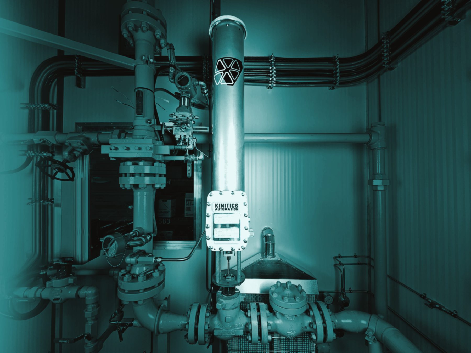 A Kinitics valve actuator installed on a process valve at an industrial site